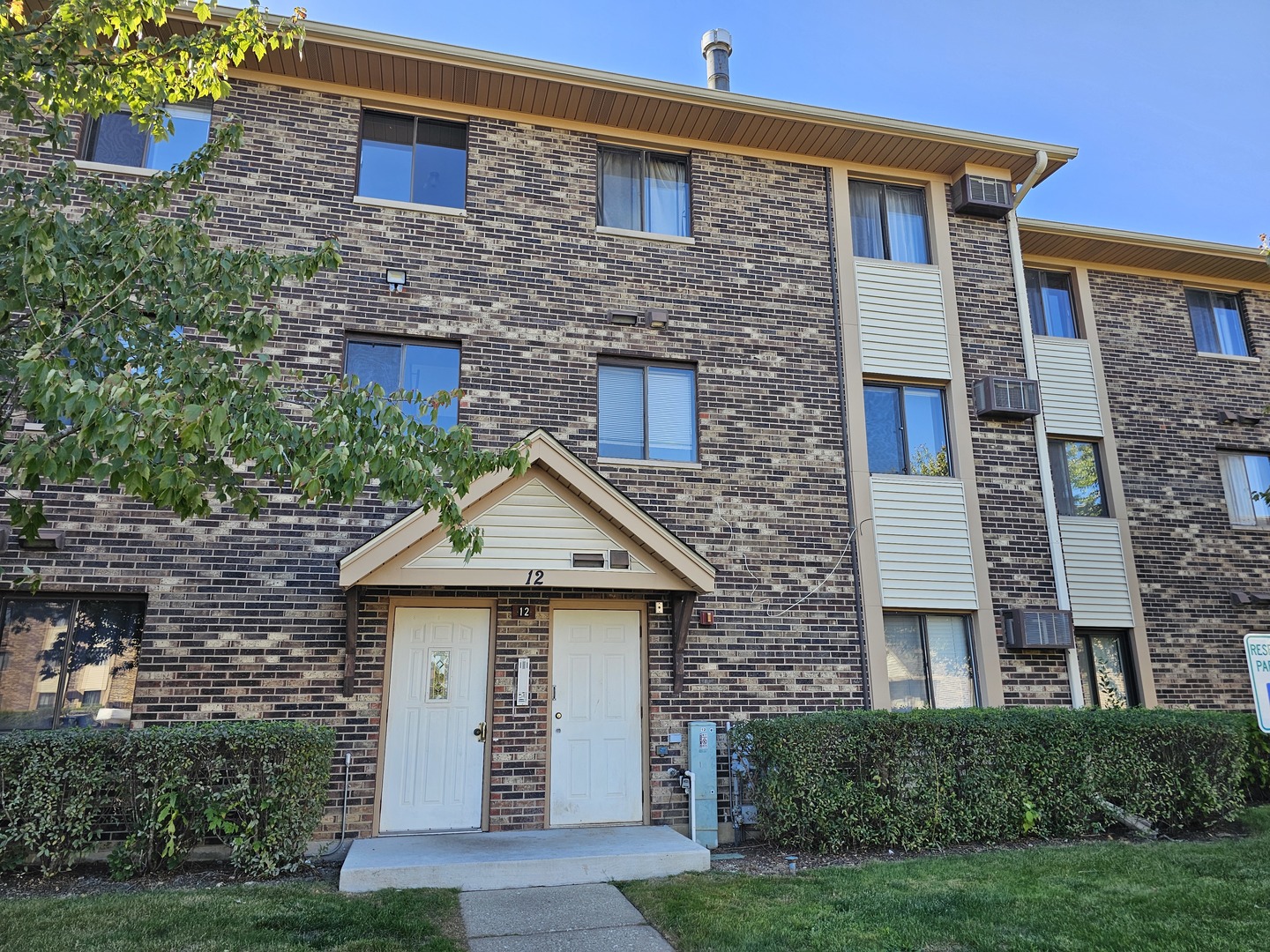 12 Parkside Court, Unit 9 Vernon Hills, IL 60061 - Photo 1 of 1 a front view of a house with garden