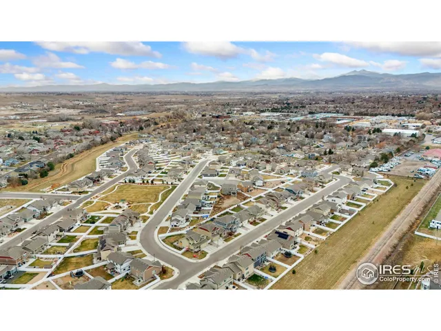 an aerial view of residential building with parking
