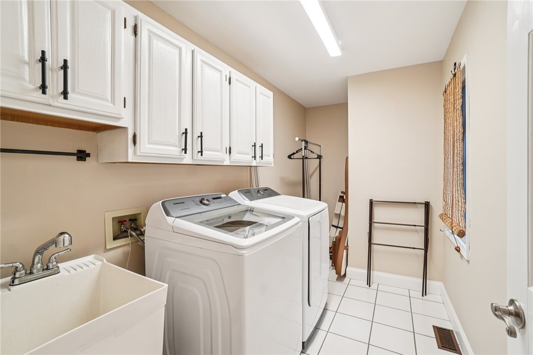 120 Beacon Ridge Circle Salem, SC 29676 - Photo 19 of 48 This dedicated laundry room provides essential functionality and smart storage solutions for daily tasks.