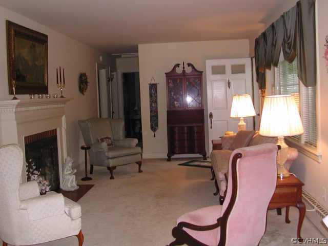 8502 Lansdowne Road Richmond, VA 23229 - Photo 3 of 9 a living room with furniture fireplace and flat screen tv