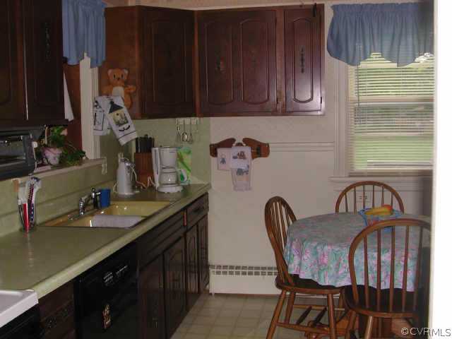 8502 Lansdowne Road Richmond, VA 23229 - Photo 4 of 9 a kitchen with granite countertop a sink a stove and cabinets