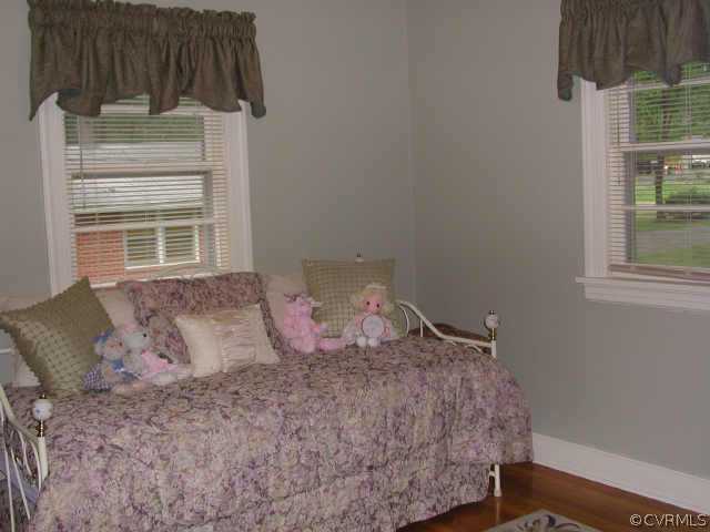 8502 Lansdowne Road Richmond, VA 23229 - Photo 8 of 9 a bedroom with a bed a lamp and window