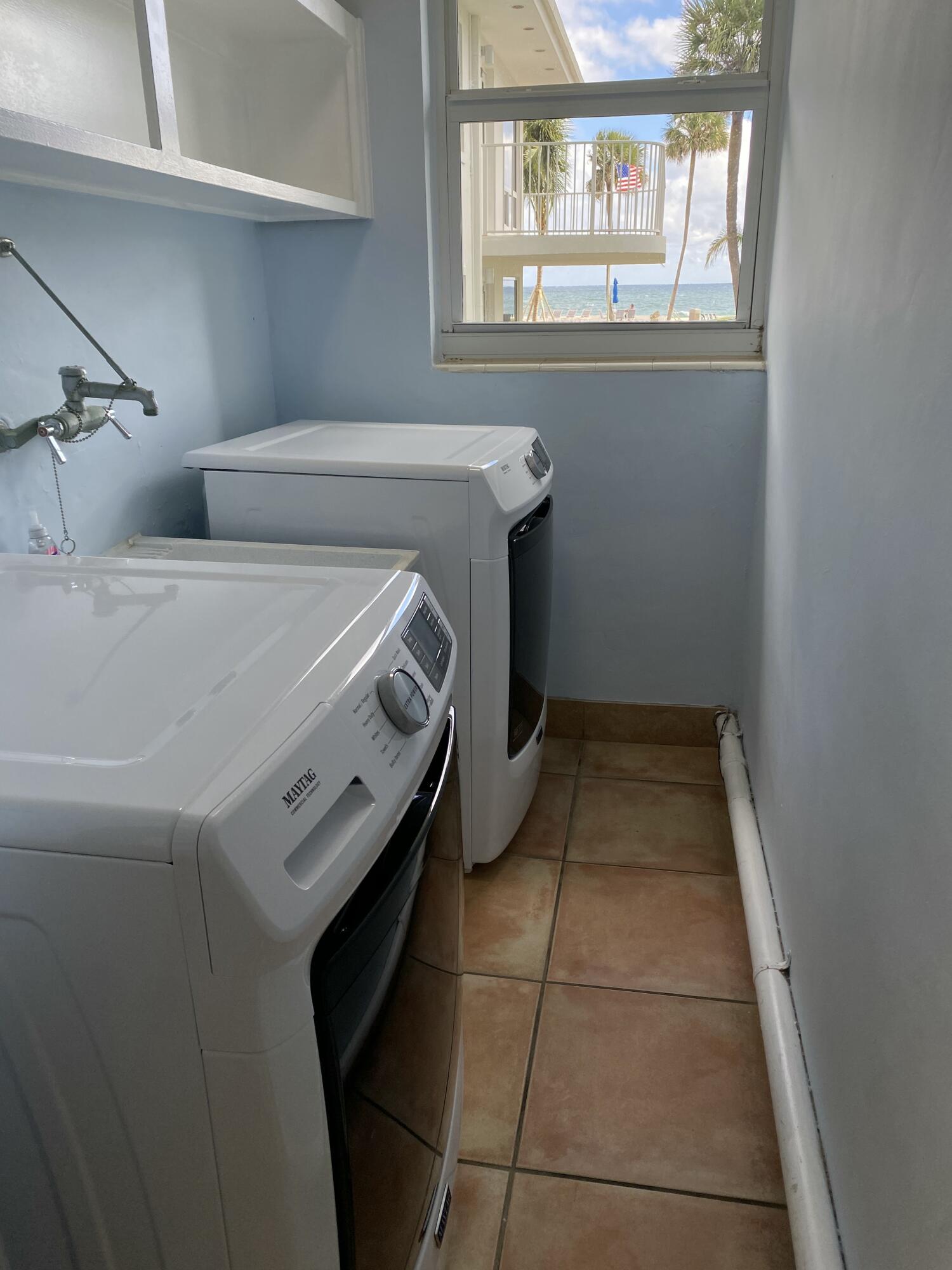 1530 South Ocean Boulevard, Unit 303 Lauderdale-by-the-Sea, FL 33062 - Photo 14 of 27 a utility room with dryer and washer