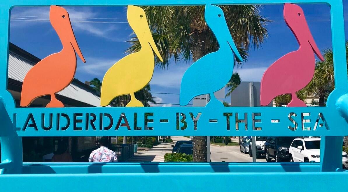 1530 South Ocean Boulevard, Unit 303 Lauderdale-by-the-Sea, FL 33062 - Photo 19 of 27 a front view of a house with a yard