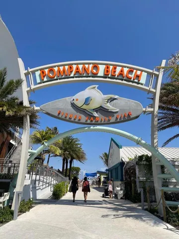 a view of street along with retail shop and buildings