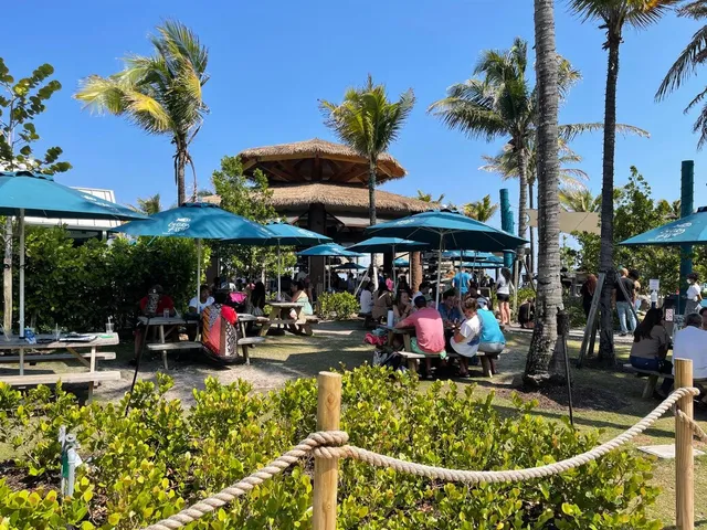 a view of people sitting in front of retail shop
