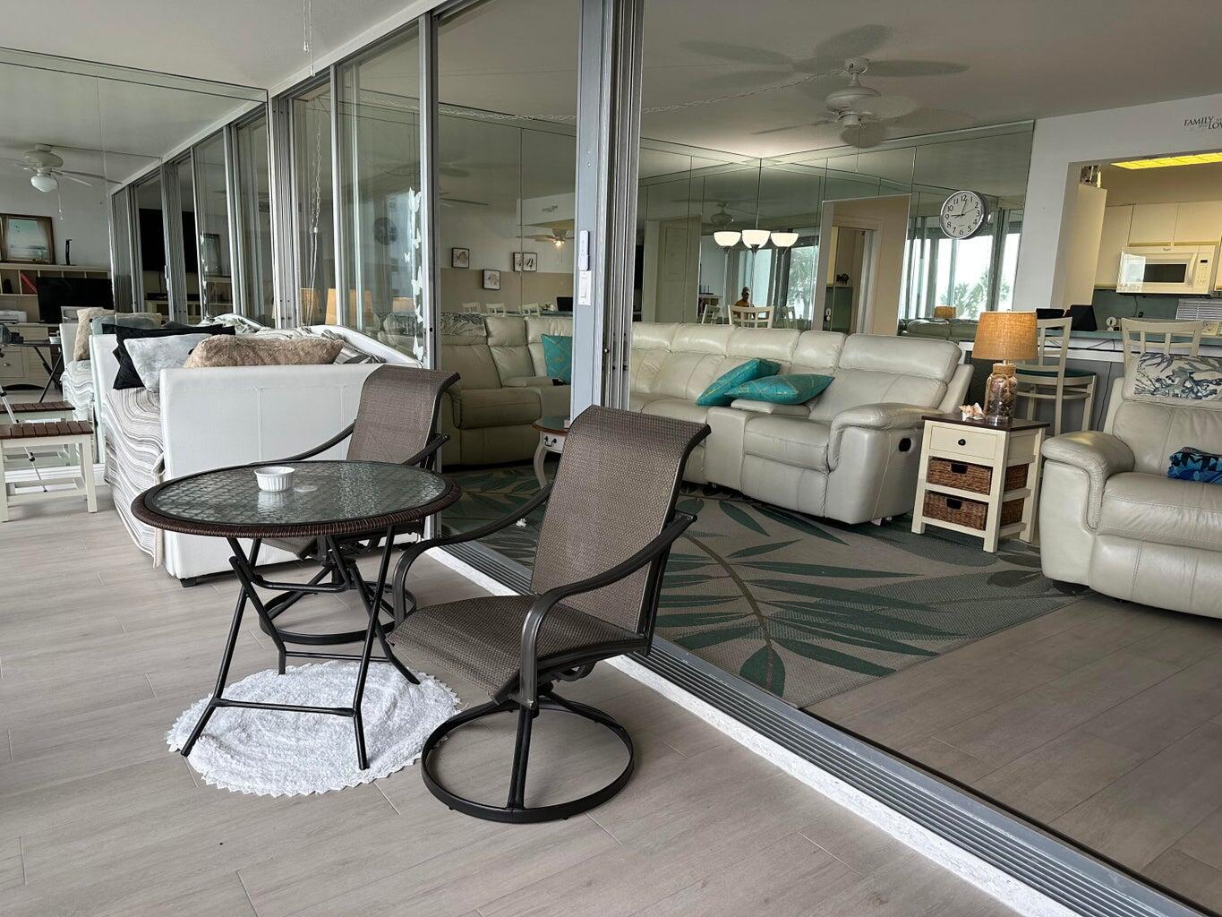 1530 South Ocean Boulevard, Unit 303 Lauderdale-by-the-Sea, FL 33062 - Photo 4 of 27 a living room with furniture