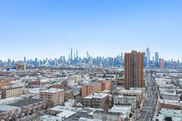 a view of a city with tall buildings in the background