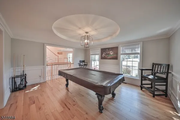 a living room with furniture a table and a large window