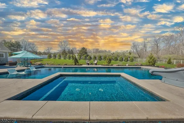 a view of swimming pool from a balcony