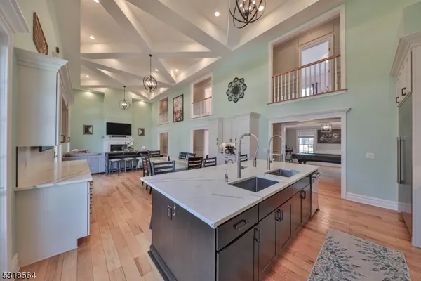 a kitchen with sink stove and cabinets