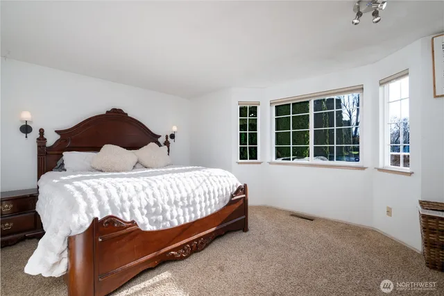 a view of room with closet and mirror