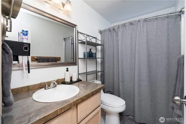 a bedroom with furniture and a window