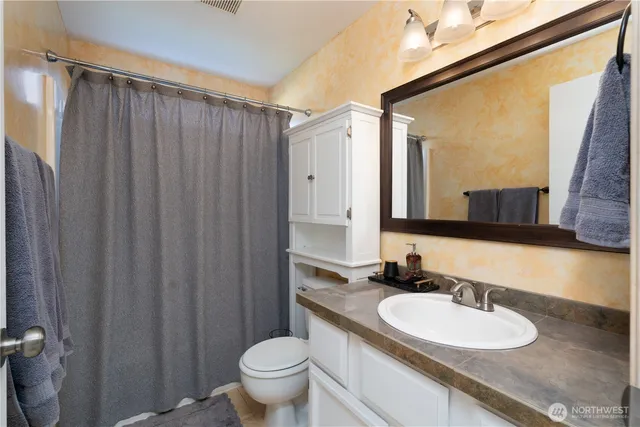 a view of a yard with chairs