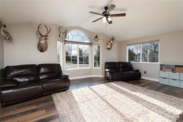 a living room with furniture and a table