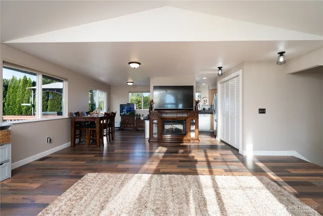 a view of a dining room with furniture window and wooden floor