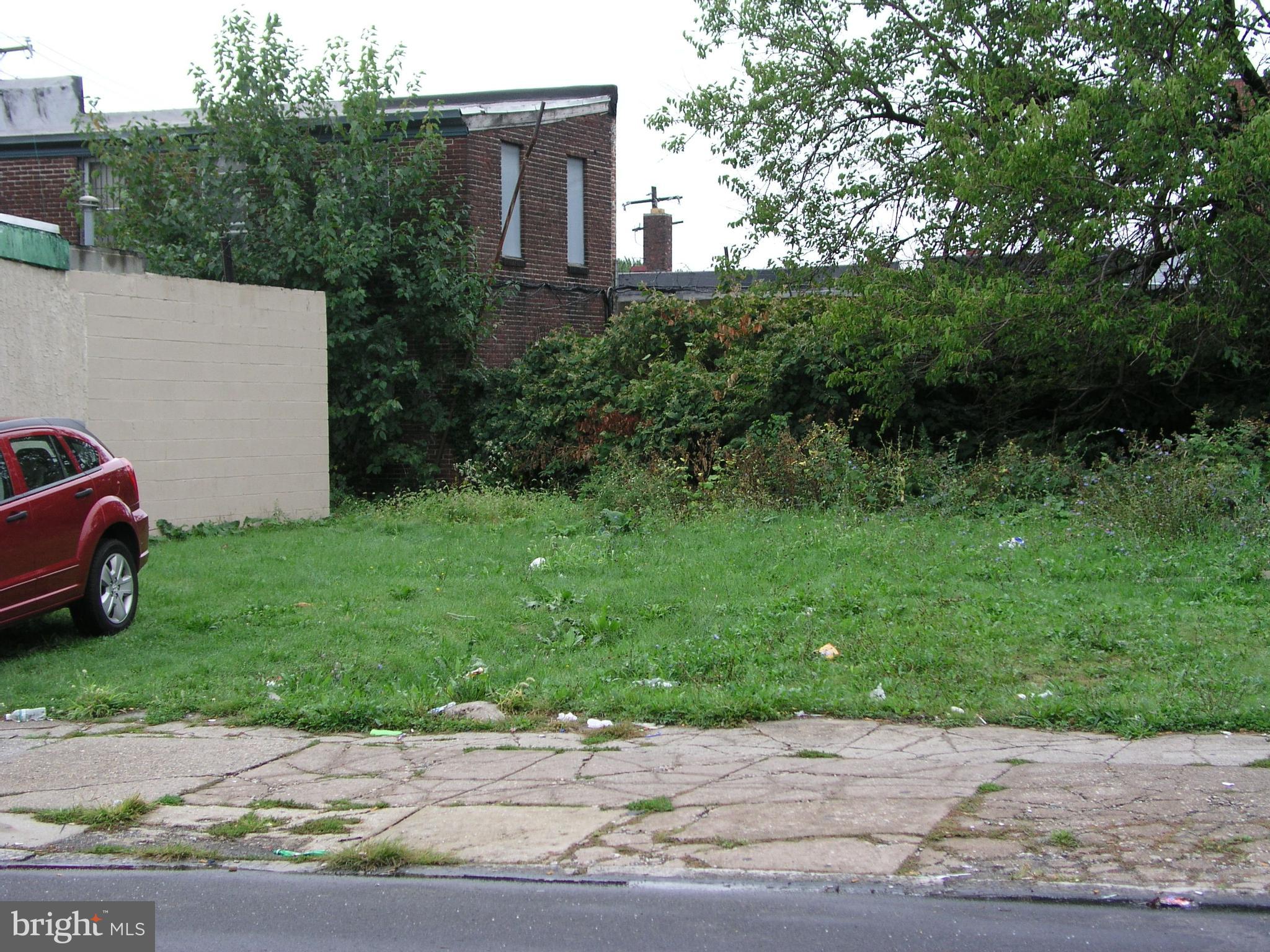1626 Margaret Street Philadelphia, PA 19124 - Photo 2 of 3 a view of a backyard with parked cars