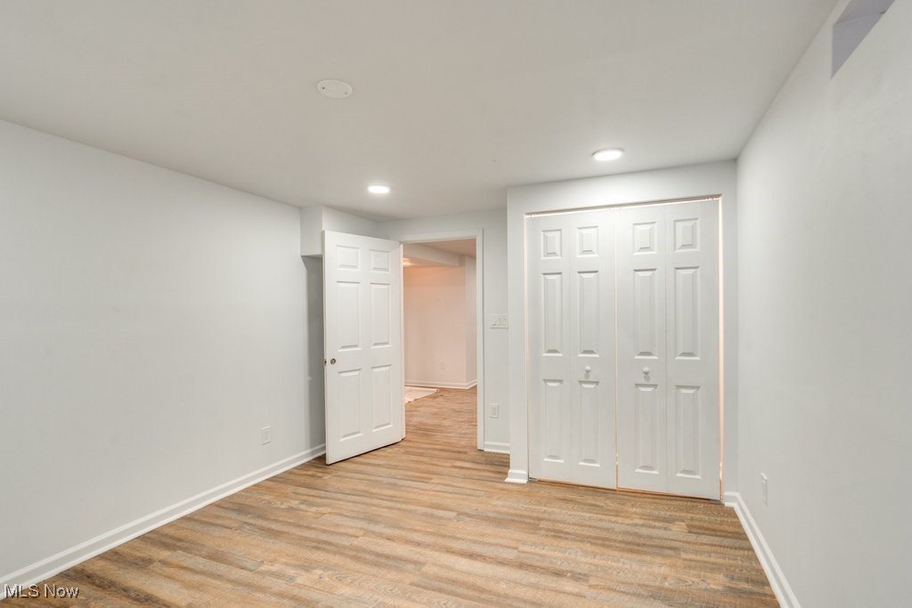 3720 Baird Road Stow, OH 44224 - Photo 33 of 45 Unfurnished bedroom featuring a closet and light wood-type flooring