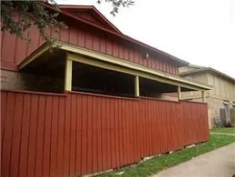 a view of a house with a wall