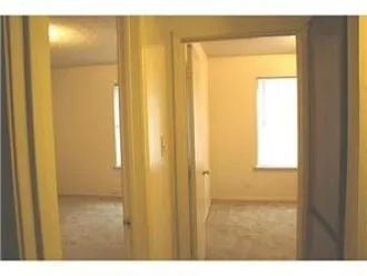 a bathroom with a shower and a door