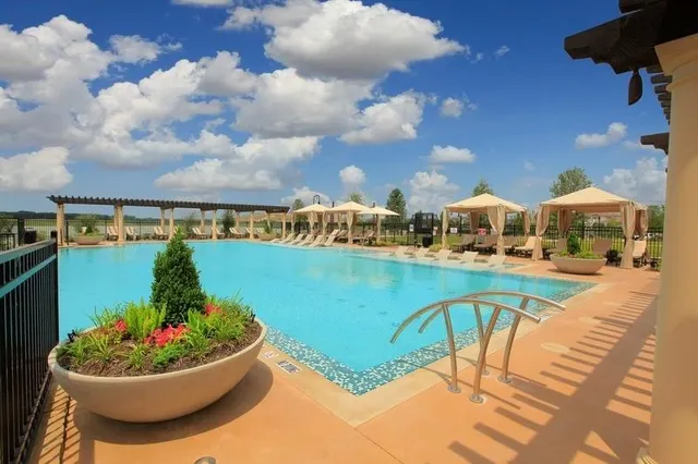 a view of a swimming pool with a patio