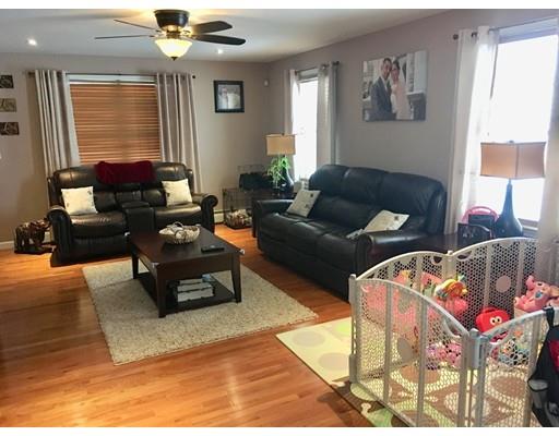 217 Reeves Street Fall River, MA 02721 - Photo 2 of 12 a living room with furniture and wooden floor