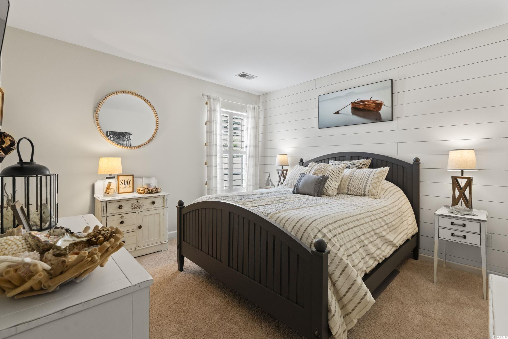 1604 Langley Drive Longs, SC 29568 - Photo 11 of 37 Bedroom featuring light carpet and wooden walls