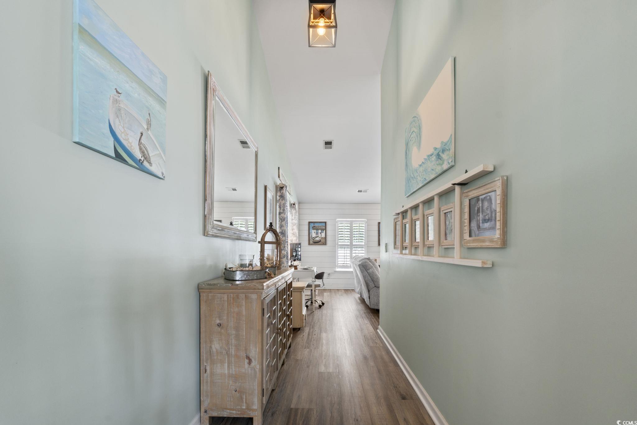 1604 Langley Drive Longs, SC 29568 - Photo 12 of 37 Hall with dark wood-style floors and baseboards