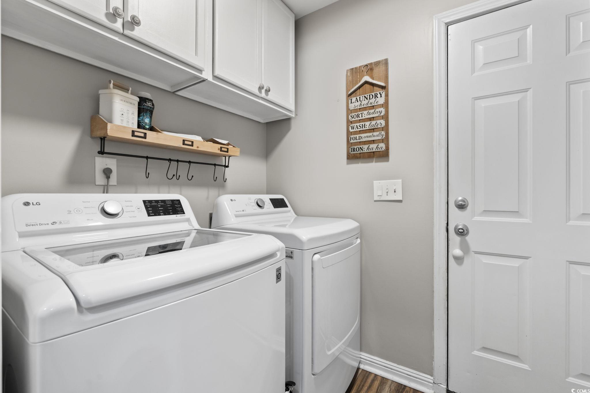 1604 Langley Drive Longs, SC 29568 - Photo 20 of 37 Laundry area with cabinet space, washing machine and clothes dryer, and dark wood-style floors