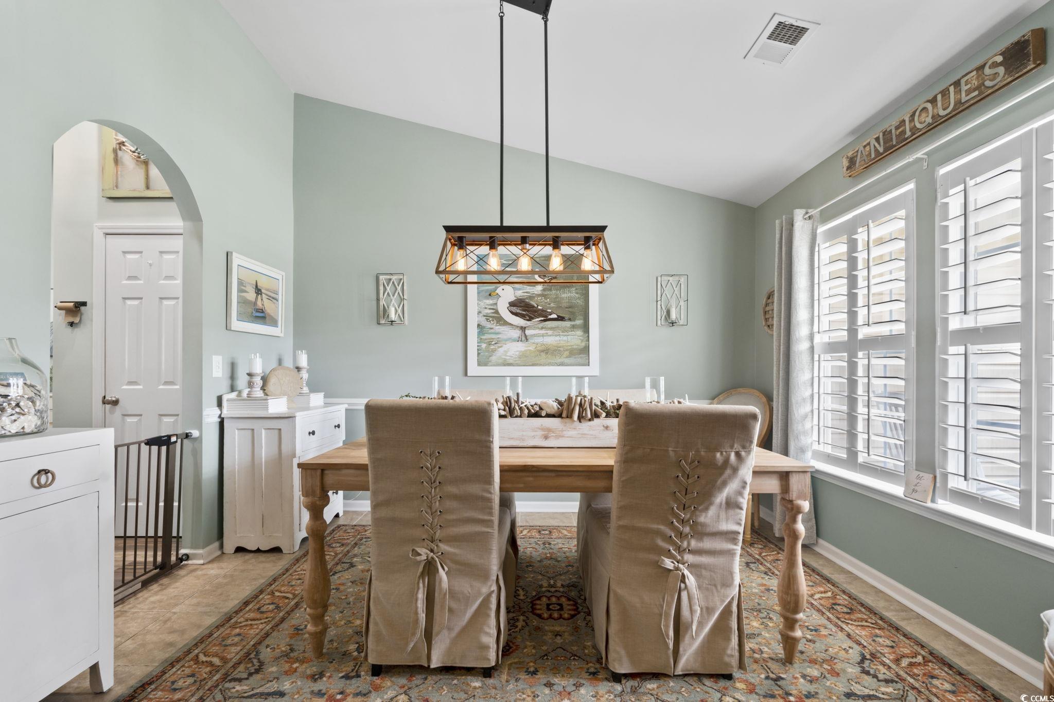 1604 Langley Drive Longs, SC 29568 - Photo 9 of 37 Dining room featuring lofted ceiling and arched walkways