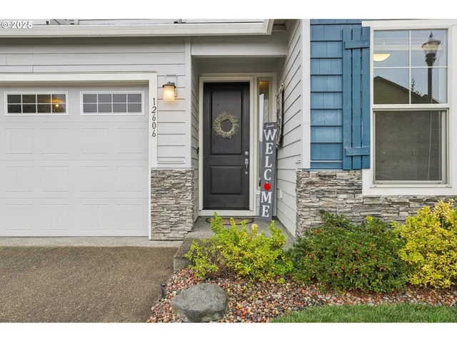 a couple of potted plants in front of door