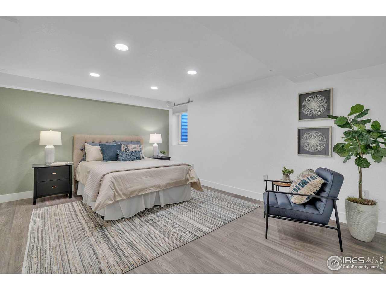 2808 Eaton Street Wheat Ridge, CO 80214 - Photo 11 of 35 a bedroom with a bed and a table