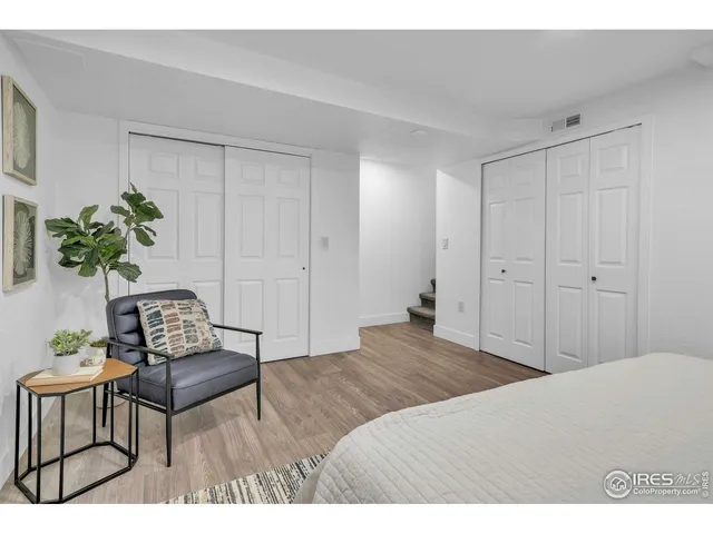 a bedroom with a bed and a table