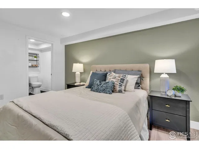 a bedroom with a bed and a chair