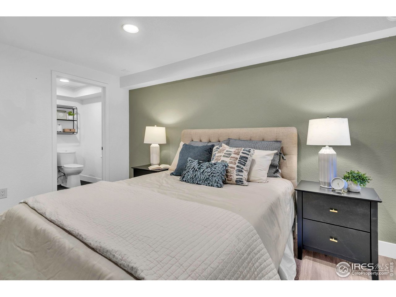 2808 Eaton Street Wheat Ridge, CO 80214 - Photo 13 of 35 a bedroom with a bed and a dresser