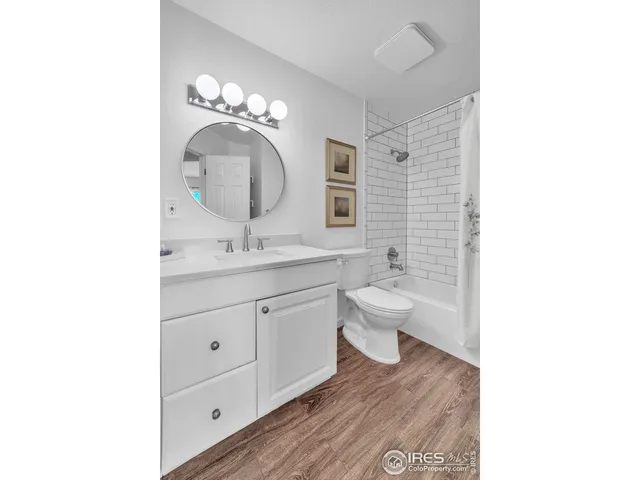 a bedroom with a bed and cabinets