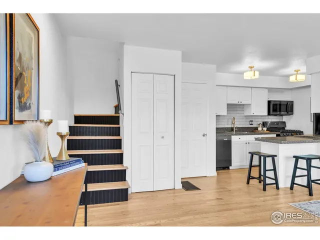 a view of kitchen with furniture and wooden floor