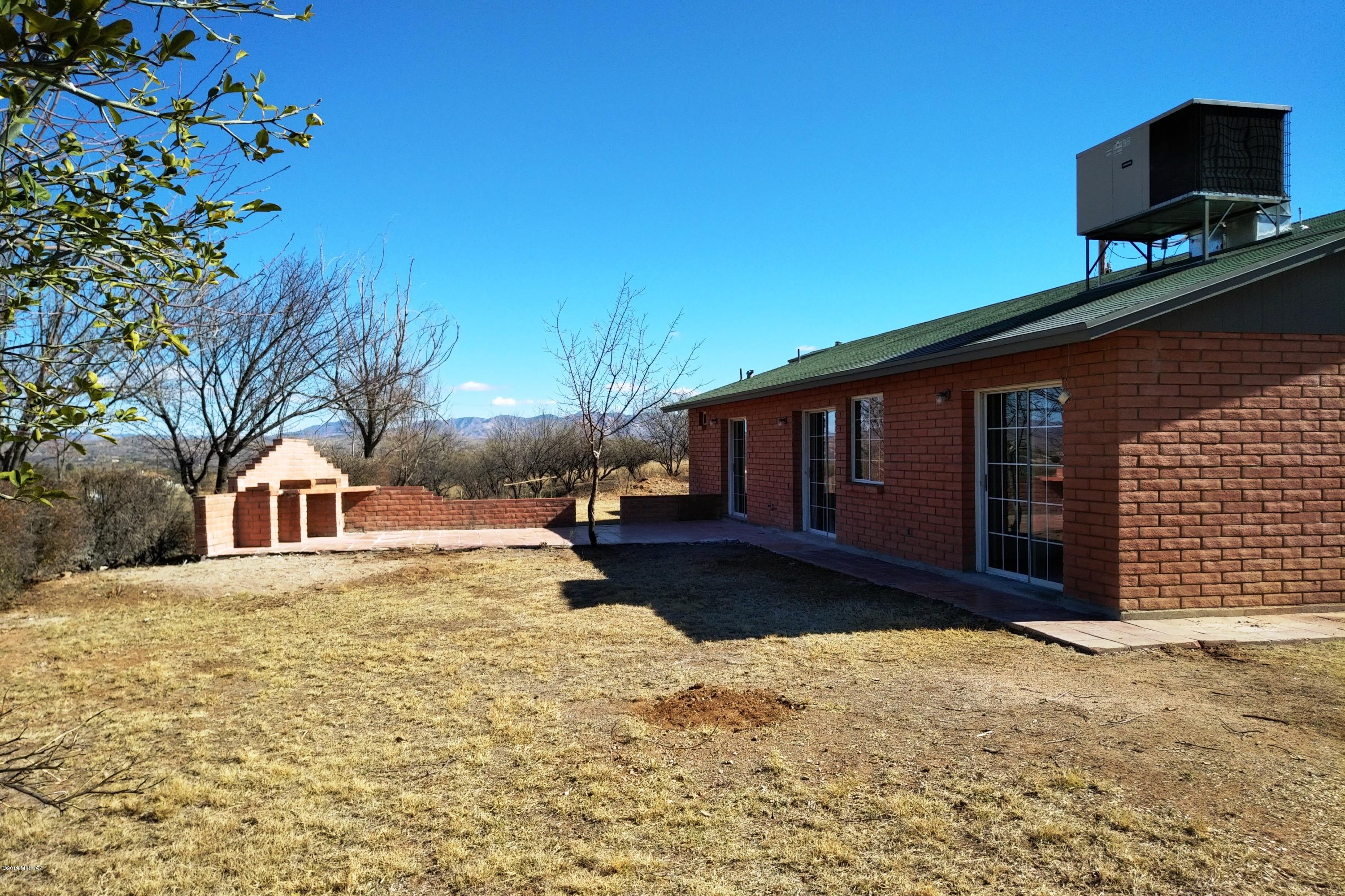 266 Mirto Court Rio Rico, AZ 85648 - Photo 3 of 22 a view of a house with a yard