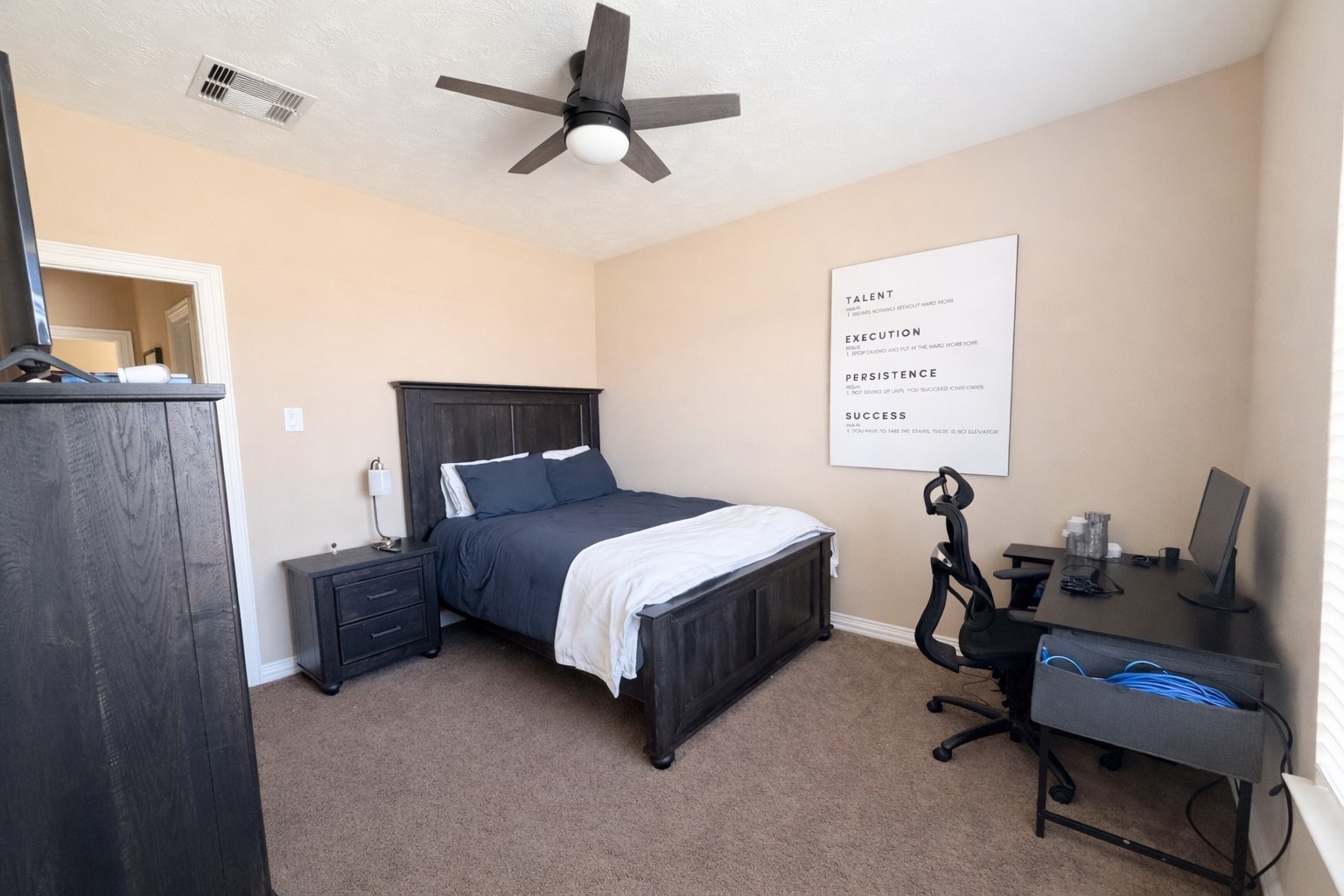 111 Meadow Ridge Way Clute, TX 77531 - Photo 12 of 17 Cozy bedroom featuring ample natural light.
