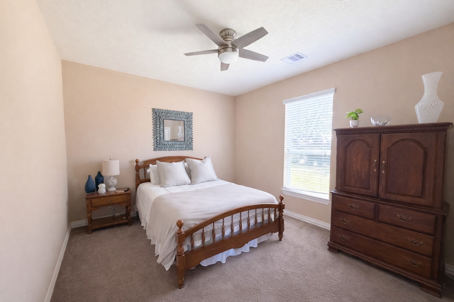 111 Meadow Ridge Way Clute, TX 77531 - Photo 13 of 17 Inviting bedroom featuring lots of natural light.