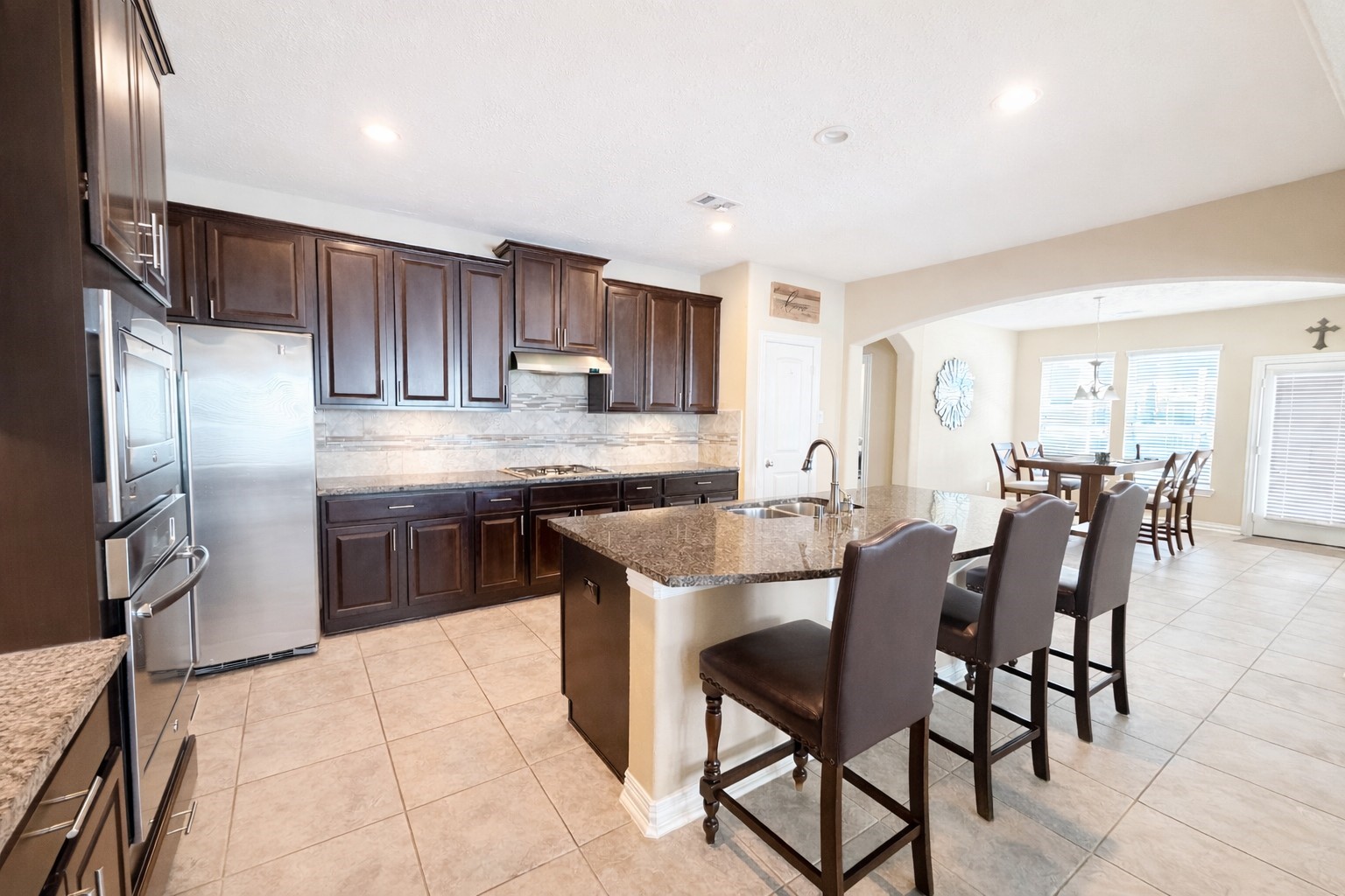 111 Meadow Ridge Way Clute, TX 77531 - Photo 4 of 17 Discover a spacious kitchen with ample counter space, perfect for hosting and creating unforgettable moments.