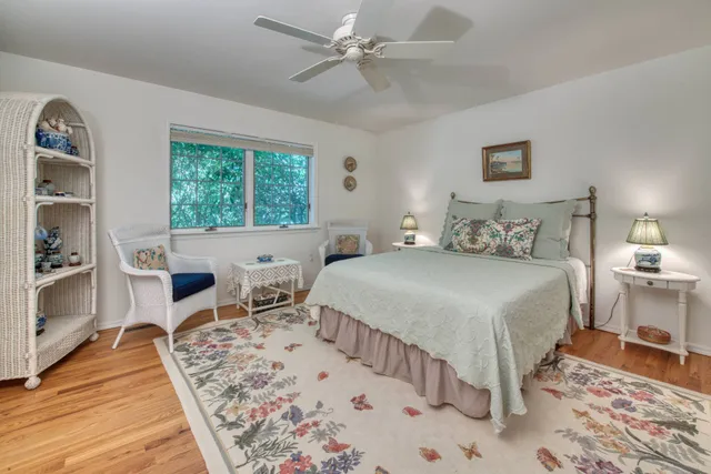 a spacious bedroom with a bed and a dresser