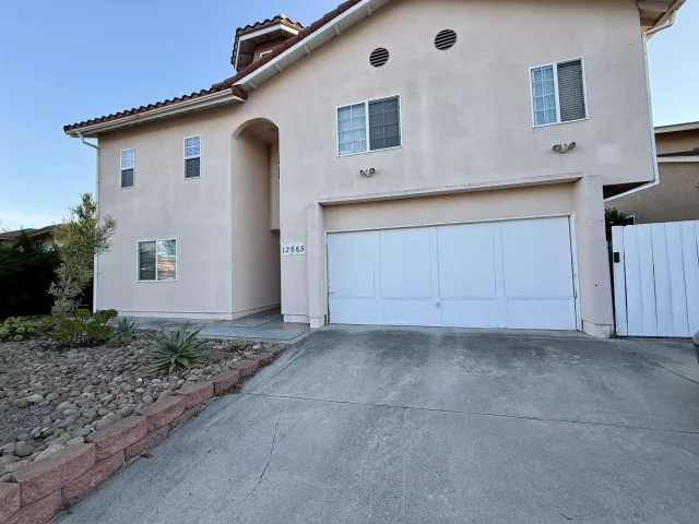 a front view of a house with garage
