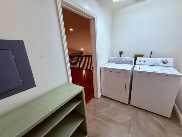 a living room with a couch and a shower