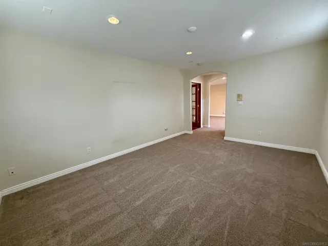 a backyard of a house with plants and outdoor seating