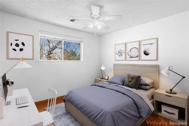 a bedroom with a bed and a desk
