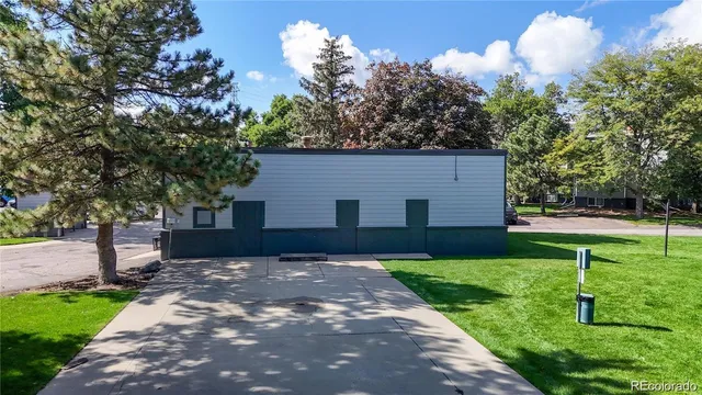 an aerial view of a house with a yard and a garden