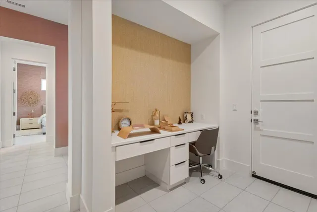 a view of a bathroom with a sink and a mirror