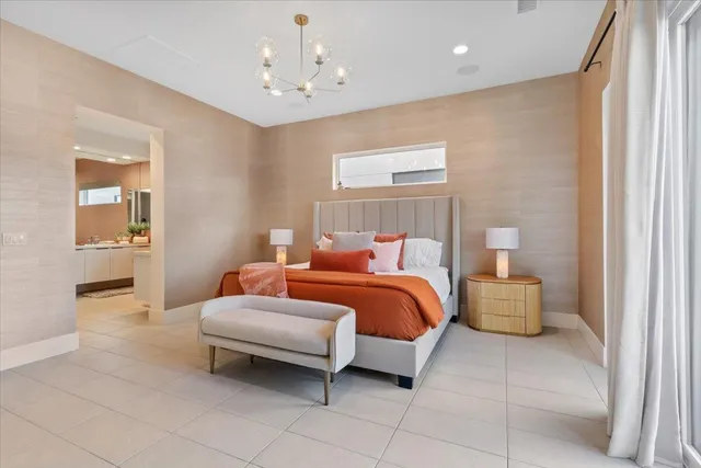 a bedroom with a bed and ceiling fan