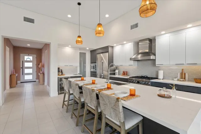 an open kitchen with a table and chairs in it